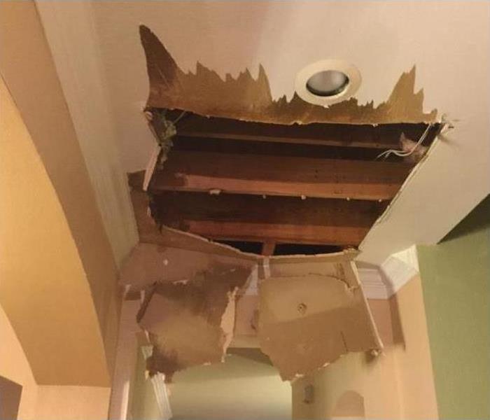 Ceiling with a hole in it after a leak