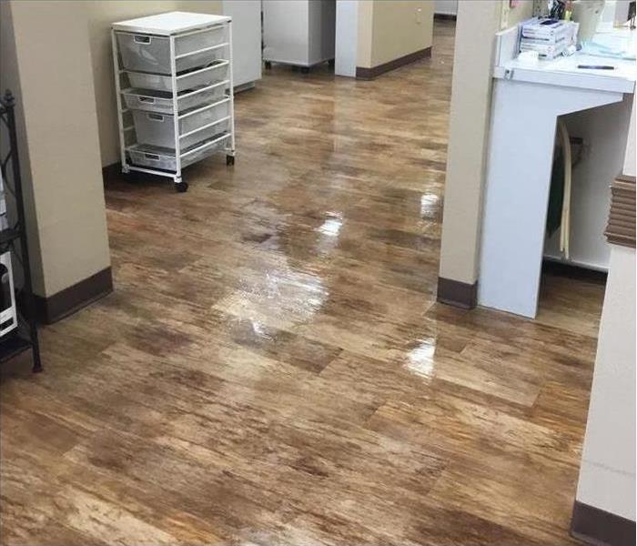 Dentist office with water damage on flooring
