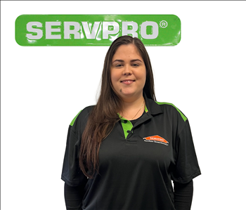 Hany, female, SERVPRO employee against a white background and green SERVPRO logo