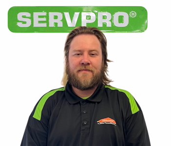 Tony Buchanan, SERVPRO green sign behind his cutout picture, white background