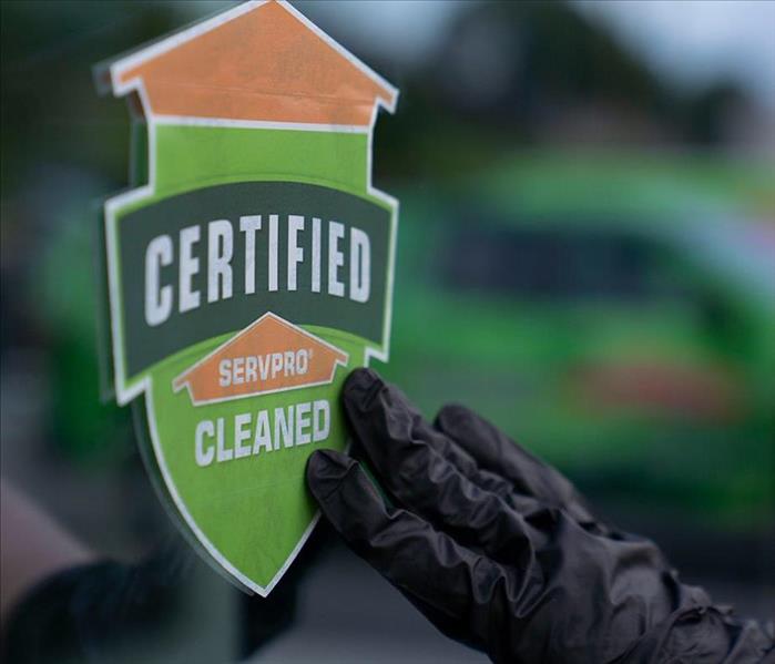 hand from a SERVPRO of South Central Fort Worth/Edgecliff Village technician placing a SERVPRO certified clean stick on a com