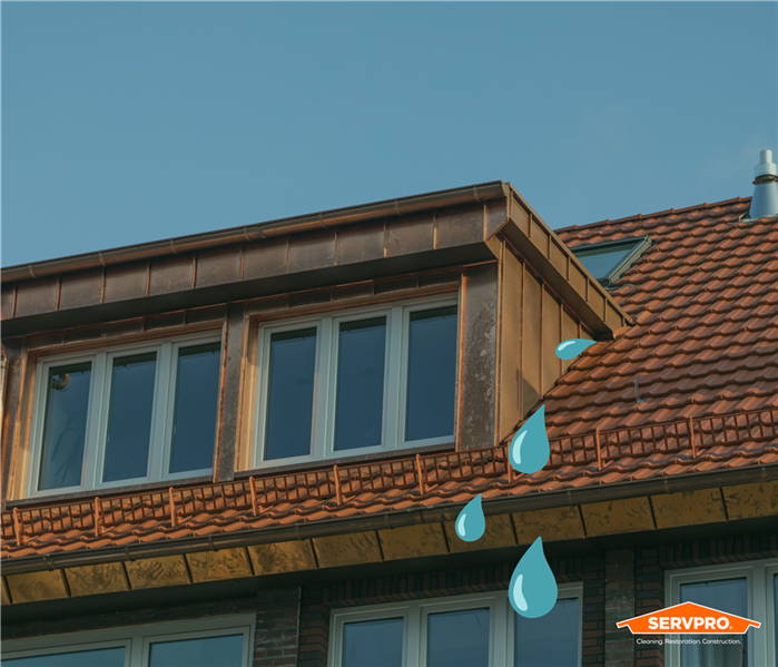  blue water drops coming from the roof of a home in South Central Fort Worth/Edgecliff Village