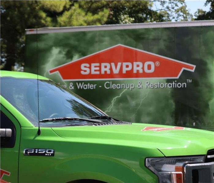 orange and green SERVPRO of South Central Ft Worth/Edgecliff Village trucks